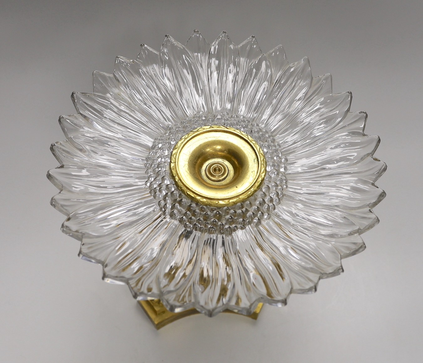 An Empire style ormolu and press moulded glass ‘sunflower’ comport, 26cms high